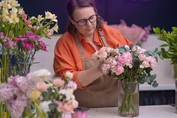 successful small business flower shop, and creative, stunning bouquet of flowers at floral shop.