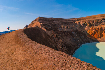 Icelandic landscape of colorful volcanic caldera Askja, Viti crater lake in the middle of volcanic desert in Highlands, with red, turquoise volcano soil and hiking trail, Iceland - obrazy, fototapety, plakaty