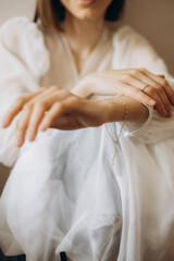 Obraz na płótnie Canvas fragile hands of a young woman in a photo with a shallow depth of field, tenderness and lightness, femininity and aesthetics in a photo of women's hands