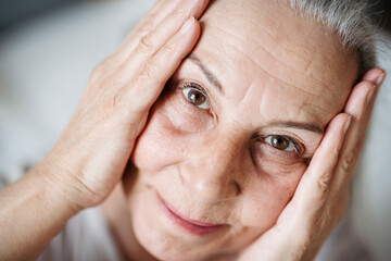 Portrait of senior woman resting in her apartment.