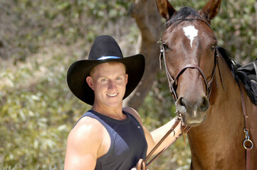 Obraz premium A portrait shot of a cowboy along with an animal portrait shot of his horse.