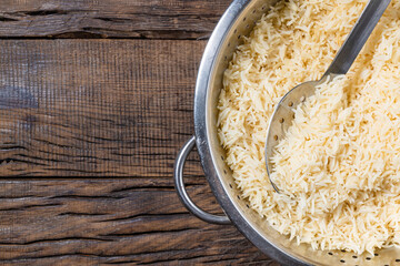 beautiful rice in a bowl on a dark wooden background