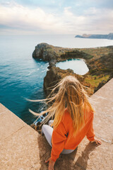 Woman on cliff enjoying Rhodes island view travel lifestyle in Greece outdoor active vacations St....