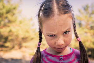 Angry girl with funny funny facial expression