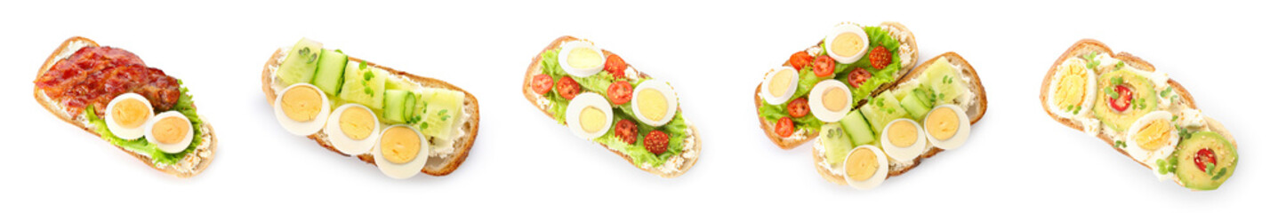 Set of tasty toasts with boiled eggs on white background, top view