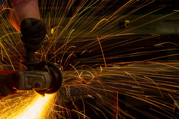 Sparks from metal grinding wheel,