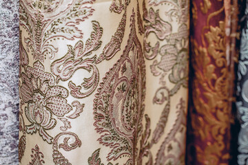 The patterned fabrics close-up. Textured image. Materials for the manufacture of carpets or curtains.