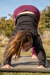 Doing yoga in the middle of mountain