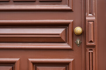 View of ornate wooden door in city, closeup