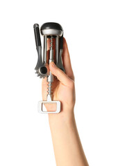 Female hand holding wine opener isolated on white background