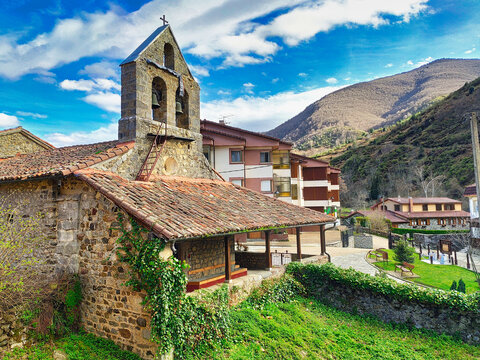 Posada de Valdeon church, Picos de Europa National Park in Background, Leon province, Spain