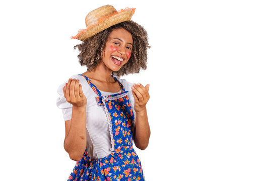 Young black Brazilian woman, with country clothes, dressed for Festa Junina. Saint John's festival. inviting hands.