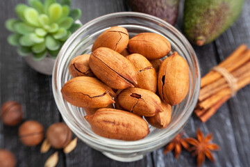 pecan nuts on wood background