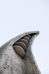 Futuristic concrete sculpture. Part of the decor of the building.