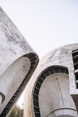 Futuristic white concrete building, flowing building. Kyiv crematorium.