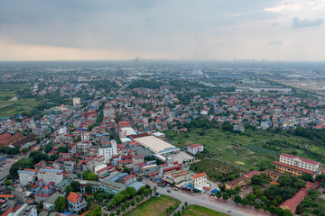 Aerial view of residential neighborhood roofs. Urban housing development from above. Top view. Real estate in Hanoi City, Vietnam. Property real estate.