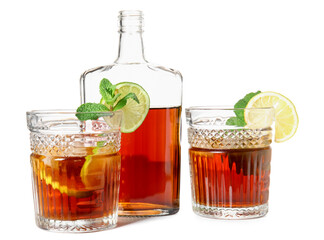 Bottle and glasses of cold rum with lime on white background
