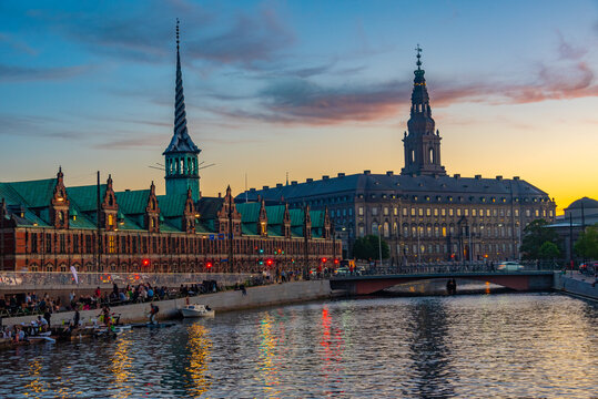 Night view of the Borsen and Christiansborg slot palace in Slotsholmen, in Copenhagen, Denmark