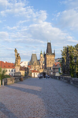 Obraz premium Beautiful view of the Malostranska tower of Charles Bridge at dawn in Prague, Czech Republic
