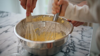 Baby woman hands mixing ingredients bowl indoors closeup. Unknown family cooking