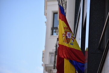 Proudly Waving The Spanish Flag on a Historic Balcony