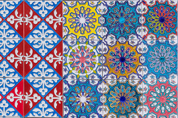 Colorfull traditional decorative tiles, known as asulejos, on a bulding in Lisbon.