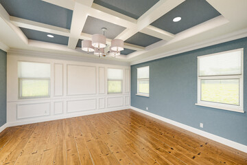 Beautiful Blue-Gray Custom Master Bedroom Complete with Entire Wainscoting Wall, Fresh Paint, Crown and Base Molding, Hard Wood Floors and Coffered Ceiling - obrazy, fototapety, plakaty