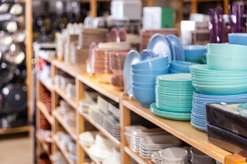 Variety of plates and bowls in modern household shop - obrazy, fototapety, plakaty