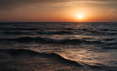 Sunset over the Mediterranean sea waves