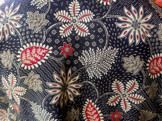 Dark batik cloth with leaf and flower motifs