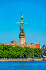 the old town of riga including saint peters church viewed over daugava river, Latvia.