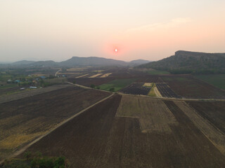 Aerial top view of paddy rice terraces, green agriculture fields in countryside, mountain hills valley, Thailand. Nature landscape. Crops harvest.