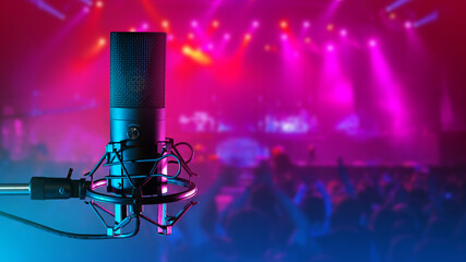 Acoustic microphone. Microphone for club musicians. Concert hall blurred. Condenser microphone on...