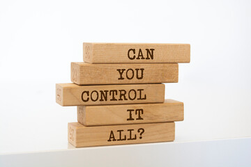 Wooden blocks with words 'Can you Control It All?'.