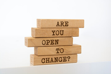 Wooden blocks with words 'Are You Open to Change?'.