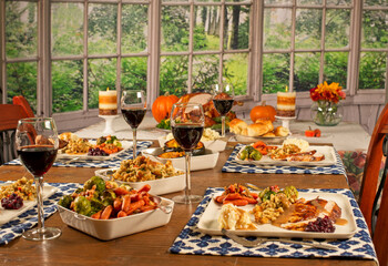 Table for thanksgiving with wine and a wonderful Autum view.