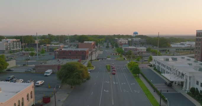 Aerial Shot Of Cars Moving On Road On City, Drone Flying Forward During Sunset - Tuscaloosa, Alabama