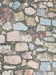 Paving texture formed by cantery stones laid in irregular shapes and colors