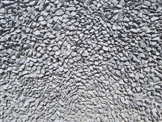 Texture formed by a panel of small white stones tending to light silver, set in varied shapes and reliefs