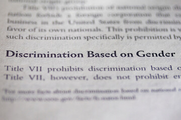 gender discrimination based on gender printed in text on page as visual aid or business law...