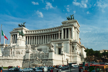 Fototapeta premium Tourists in Piazza Venezia in front of the imposing Victor Emmanuel II monument in Venezia place, Rome, Italy