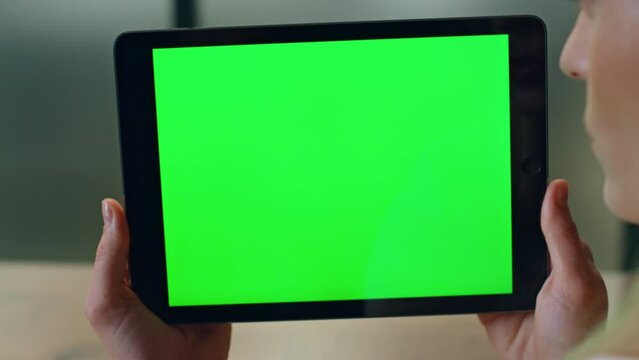 User holding chromakey computer indoors closeup. Woman talking device video call