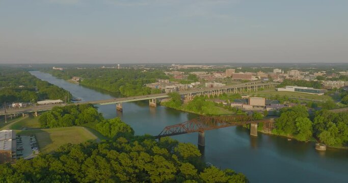 Aerial Forward Shot Of Black Warrior Railroad Bridge By Famous Stadium In City On Sunny Day - Tuscaloosa, Alabama