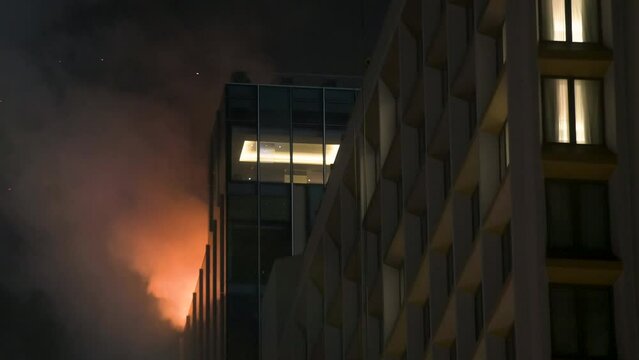 A fire breaks out in an office building under construction in Hong Kong.