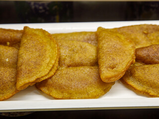 Traditional Turkish Dessert Tas Kadayif on white plate close up top view. Full frame background.