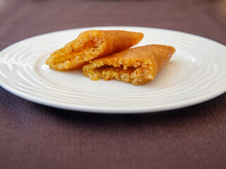 Traditional Turkish Dessert Tas Kadayif on white plate close up top view. Cut.