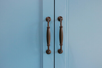 Handle to open and close the blue wardrobe door. - 586413831