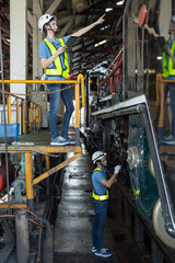 Engineer train Inspect the train's diesel engine, railway track in depot of train
