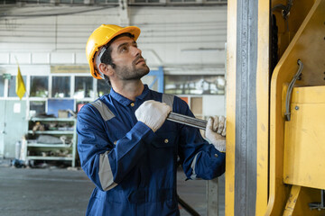 Portrait of Engineer train Inspect the train's diesel engine, railway track in depot of train
