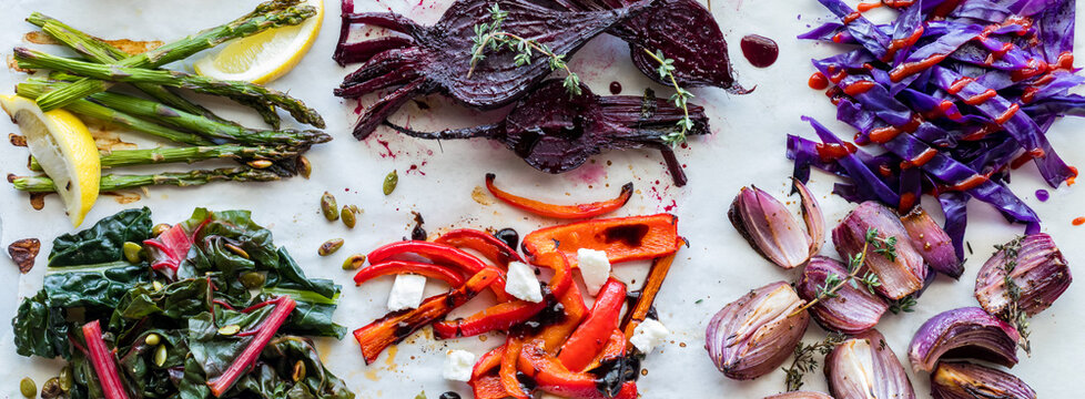 Narrow view of messy groups of steamed, sauteed and roasted vegetables.